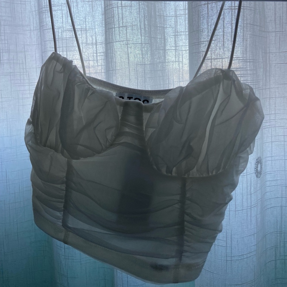 A white crop top from a boutique called Madida